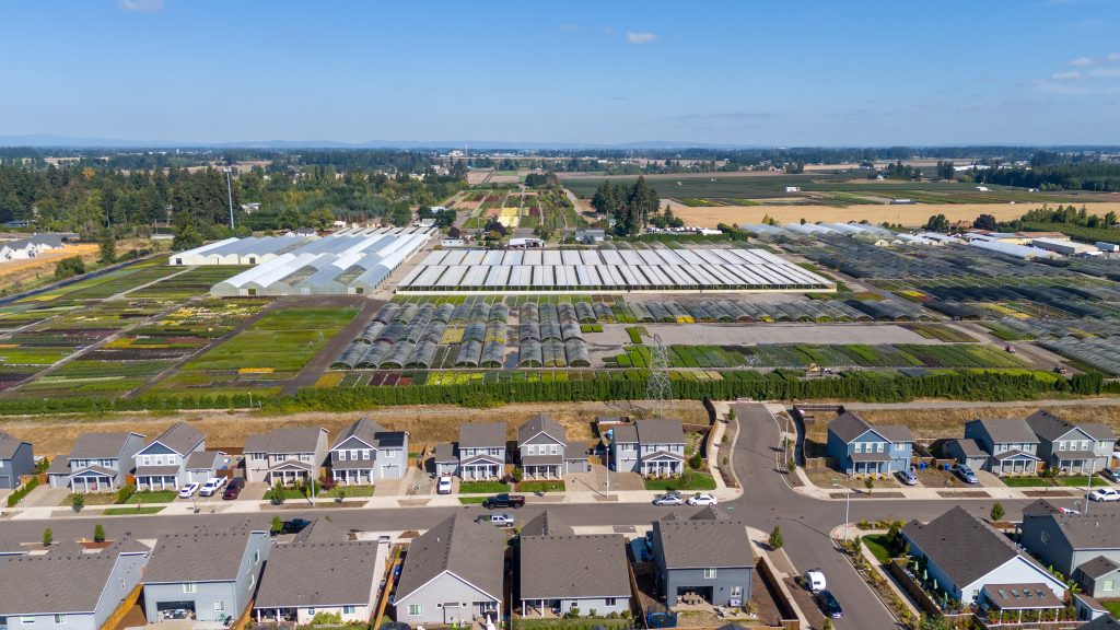 aerial image of subdivision with nursery beyond