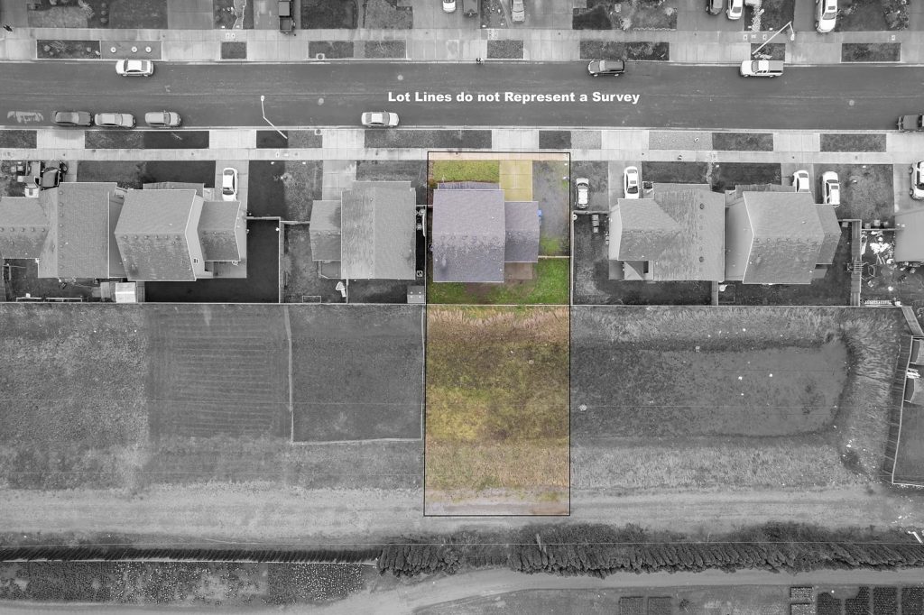 Drone image looking straight down at home, with property lines called out